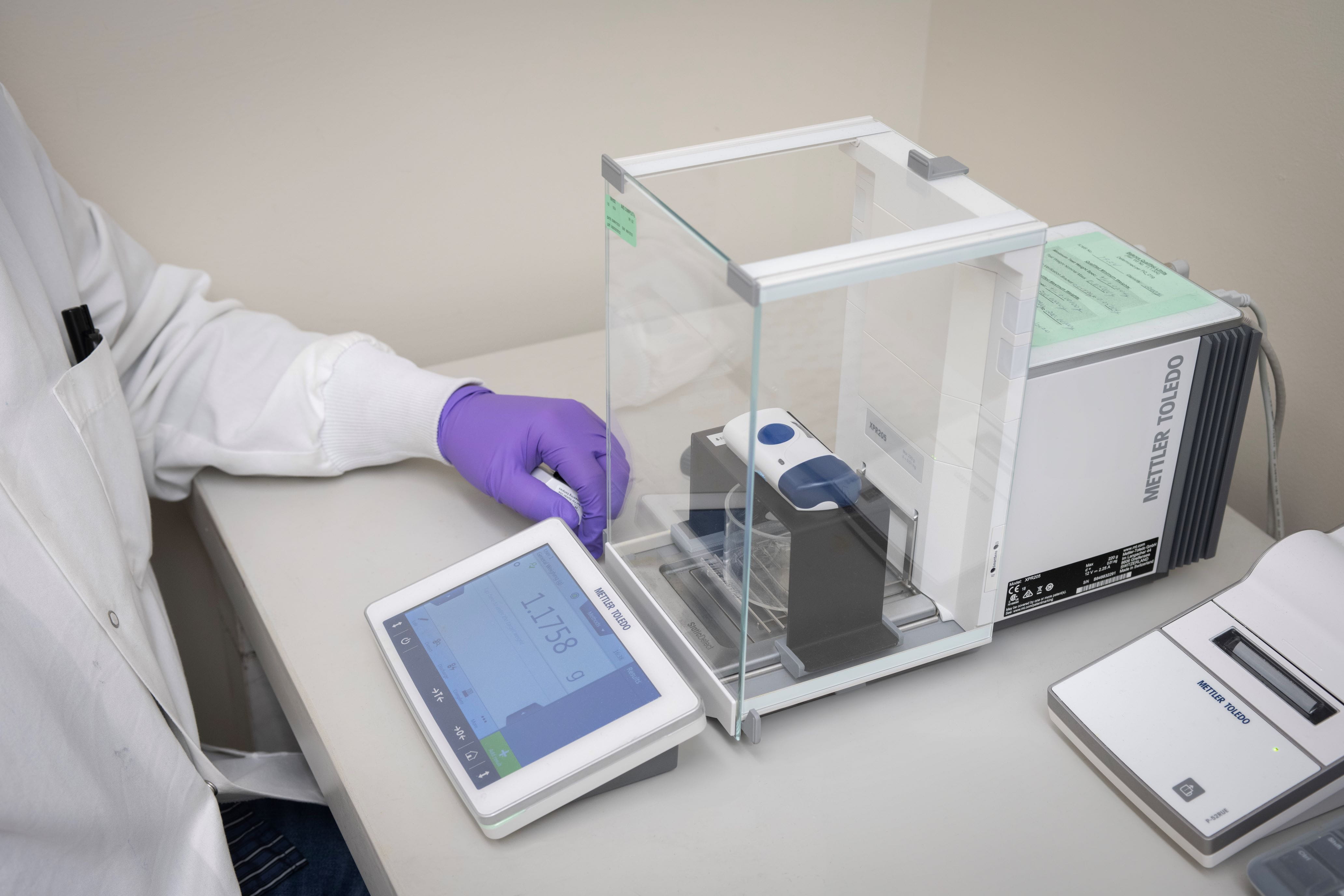 Scientist in a lab at West performing laboratory testing for Essential Drug Delivery Output verification, as part of FDA's new guidance for combination products