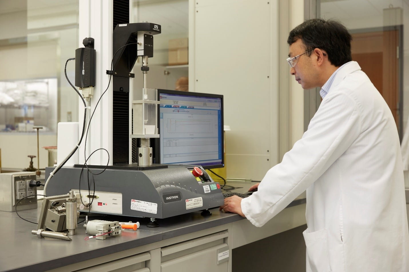 Scientist testing combination products and drug packaging in lab