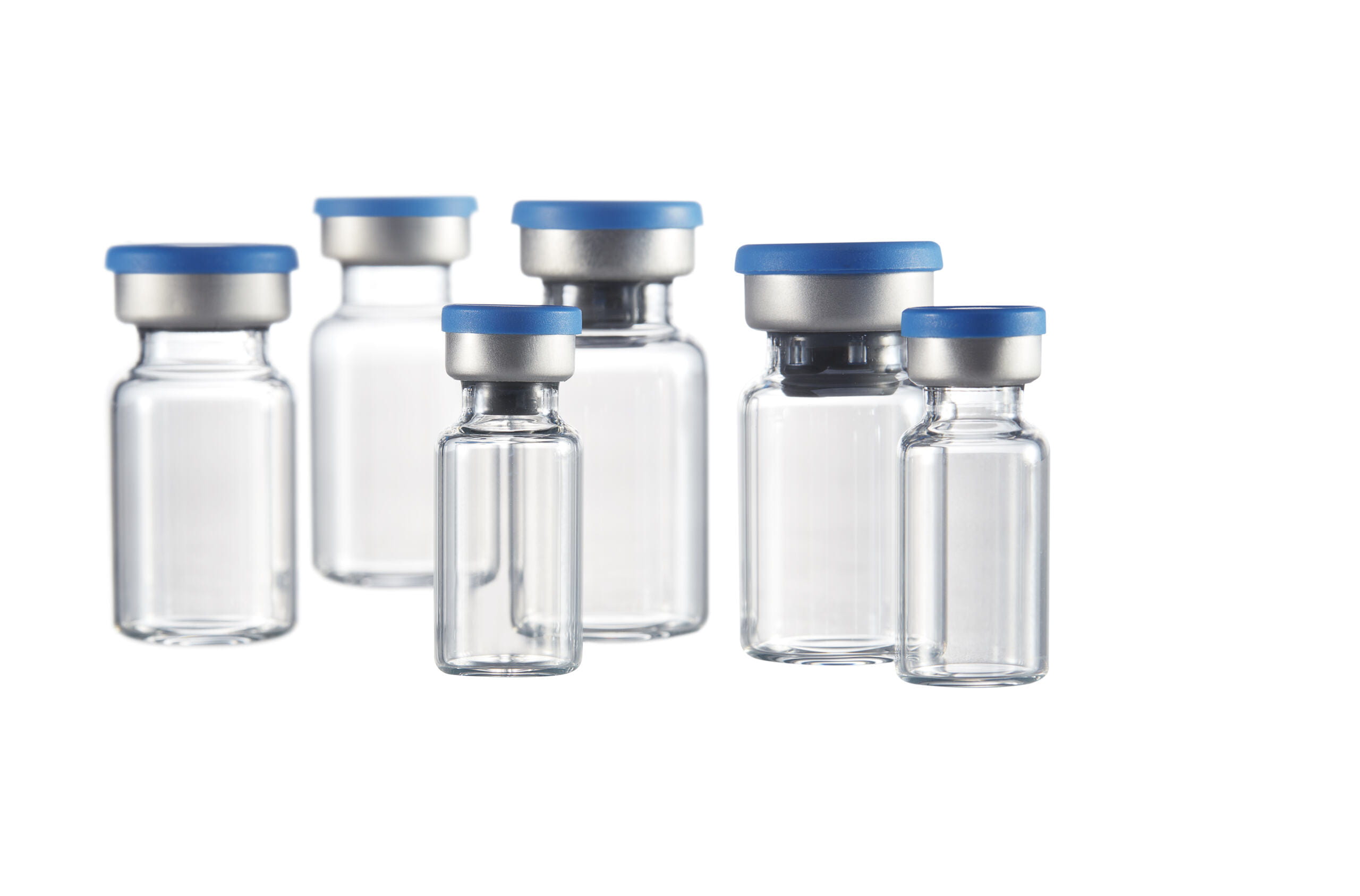 Array of Corning Valor Glass Vials with caps, illustrating strength and efficiency in pharmaceutical packaging