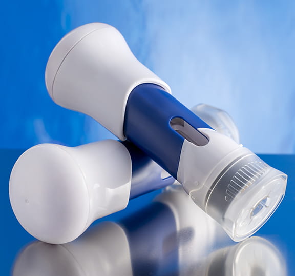 SelfDose on-body injector device on a blue background.