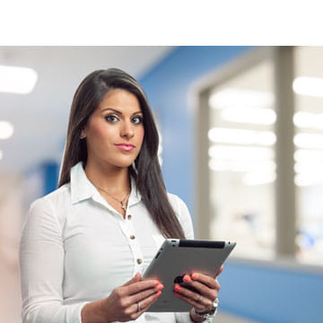 A West employee in quality support with an ipad